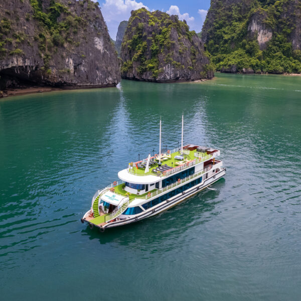 Luxury day cruise sailing through the limestone islands of Ha Long Bay