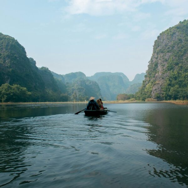 Rowboat ride through the limestone caves of Tam Coc, Ninh Binh